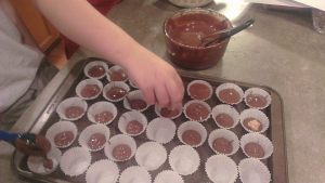 The boys making Peanut Butter Cups